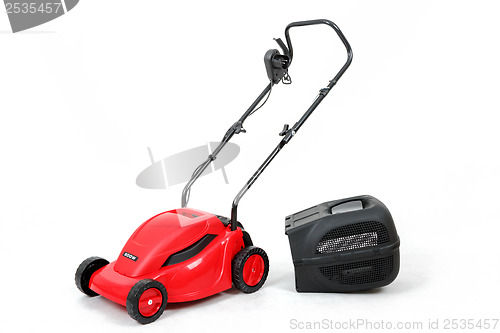 Image of new red lawnmower on white background