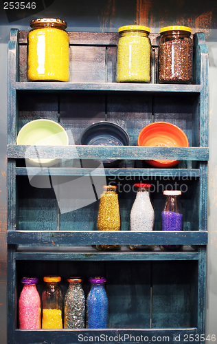 Image of Shelf full of bottles of beads and craft supplies