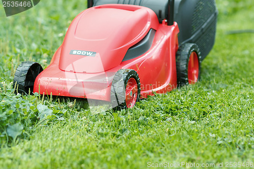 Image of new lawnmower on green grass