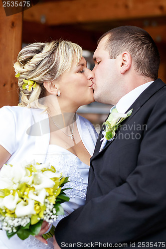 Image of beautiful young wedding couple outdoor