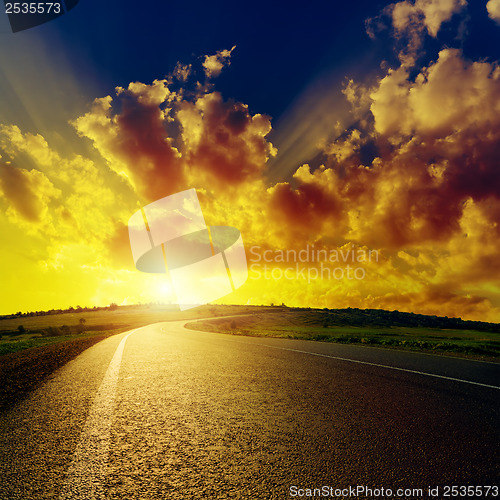 Image of fantastic sunset over asphalt road