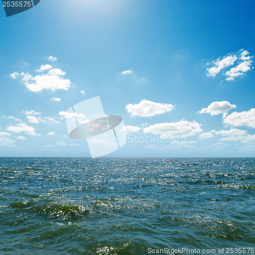 Image of wave on sea and blue sky