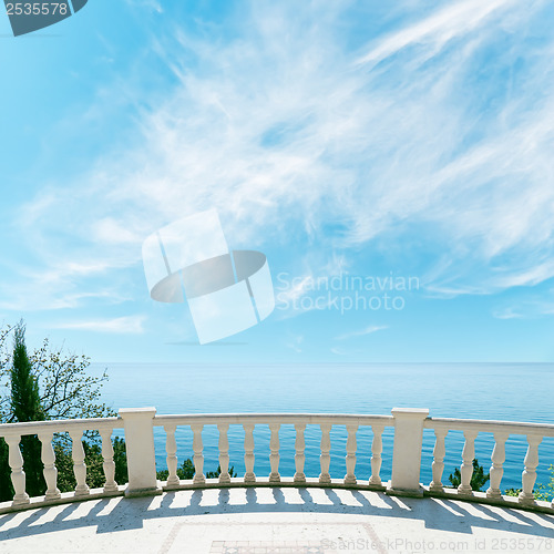 Image of balcony over sea and cloudy sky