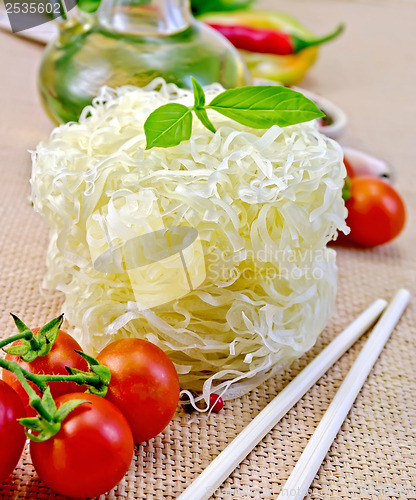 Image of Noodles rice twisted with oil and vegetables on sacking