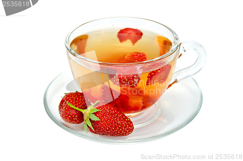 Image of Tea with strawberries in a glass cup