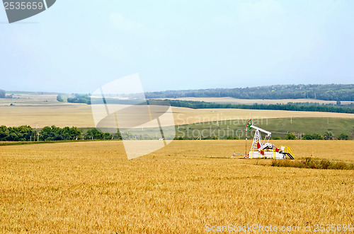 Image of Grain field with oil pump