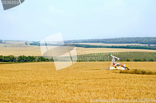 Image of Grain field with oil pump