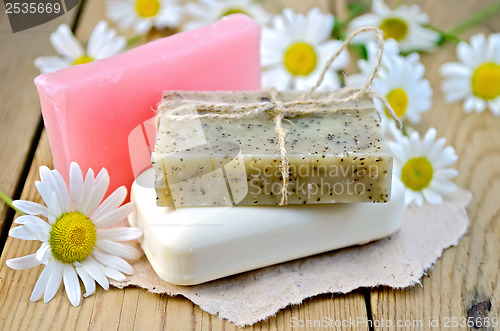 Image of Soap with chamomile on a board