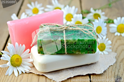 Image of Soap homemade with chamomile on a board