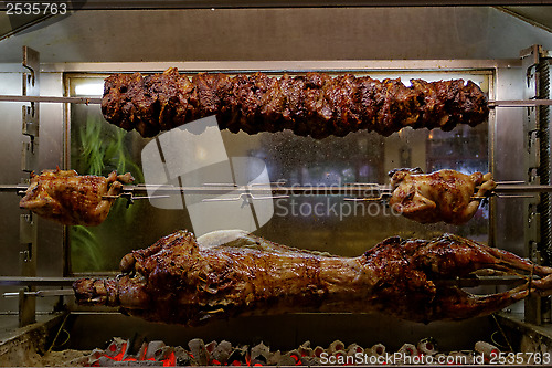 Image of the grill roasted a pig, a goat in the chicken