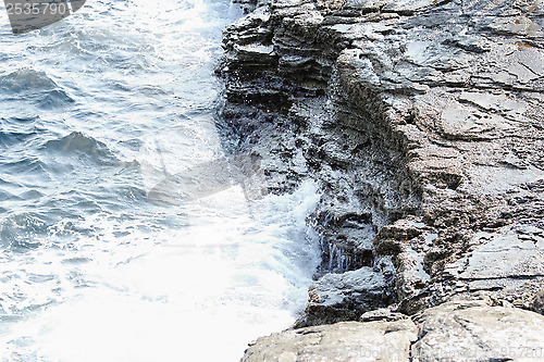 Image of rocky beach and huge waves