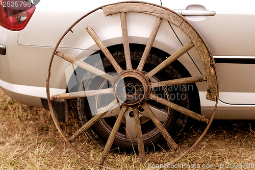 Image of old wagon wheel addition on new cars