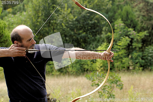 Image of man shooting with bow