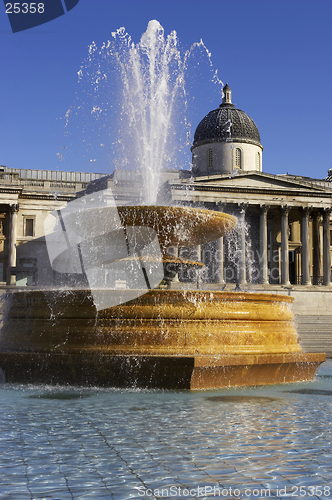 Image of Fountain in Trafalgar square with national portrait gallery in the background