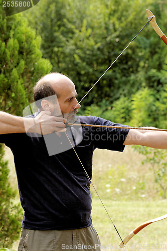 Image of man shooting with bow