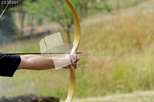 Image of man shooting with bow