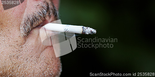 Image of Man smoking a cigarette