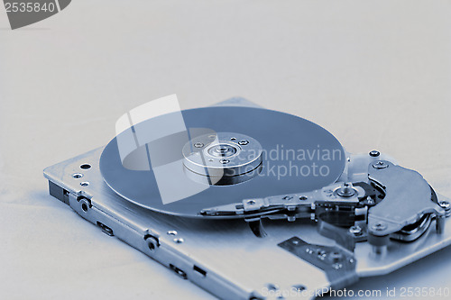 Image of Open computer hard drive on white background