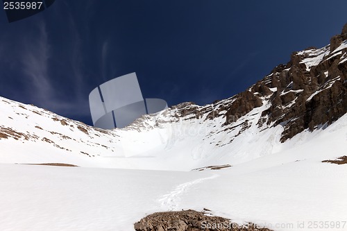 Image of Snowy mountains and blue sky at nice winter day