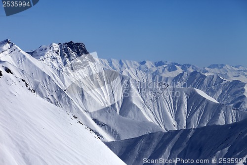 Image of Snowy winter mountains in haze