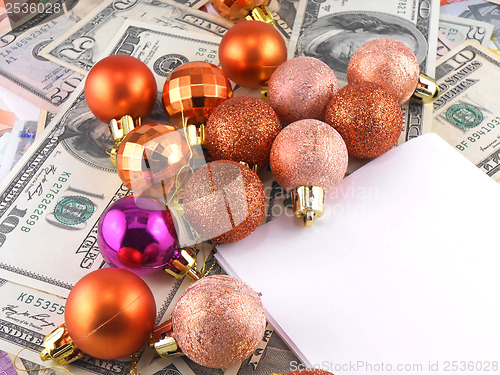 Image of Dollars notes with christmas balls on it