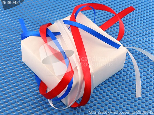 Image of White gift box with red ribbon bow