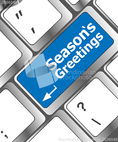 Image of Computer keyboard with seasons greetings keys - holiday concept