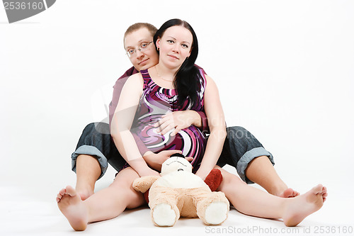 Image of Young happy couple. Husband and pregnant wife