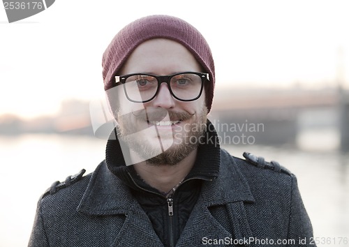 Image of Young man with moustache and beard