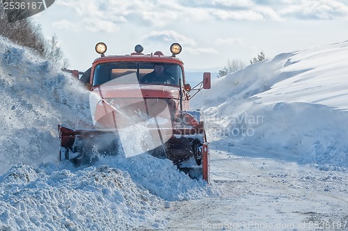 Image of truck cleaning road in winter