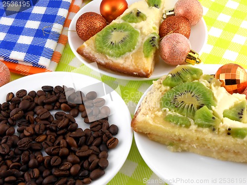 Image of Christmas decoration with coffee beans and sweet kiwi cake