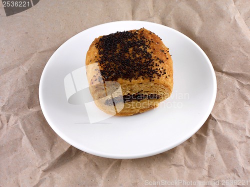 Image of sweet poppy seed cake on white plate