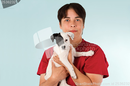 Image of Woman holding puppy dog