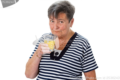 Image of Elderly woman drinking orange juice