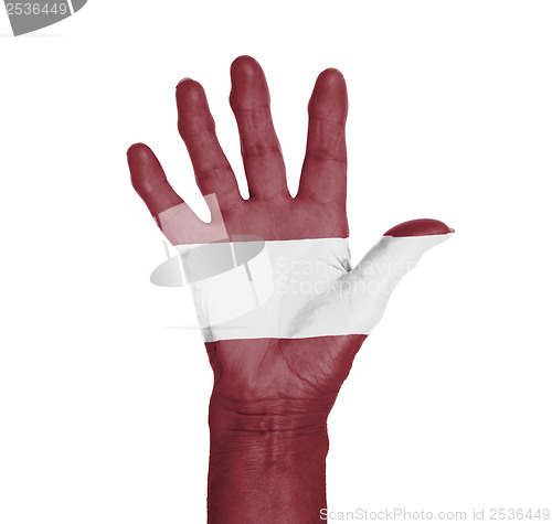 Image of Palm of a woman hand, painted with flag