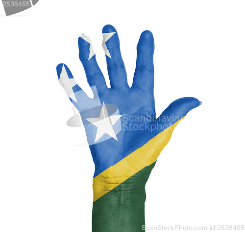 Image of Palm of a woman hand, painted with flag