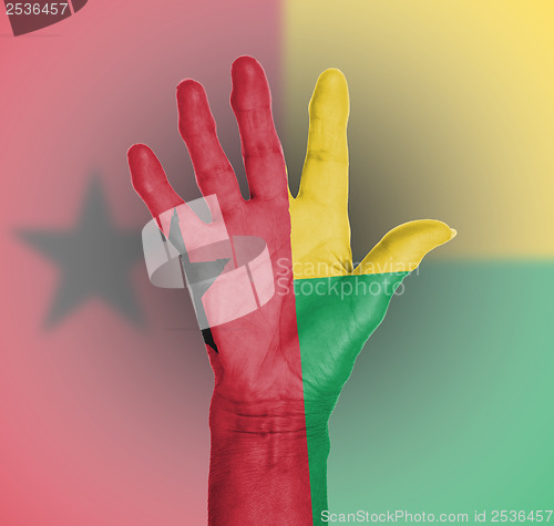 Image of Palm of a woman hand, painted with flag