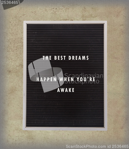 Image of Dreams - Inspirational quotation about life on a very old menu b