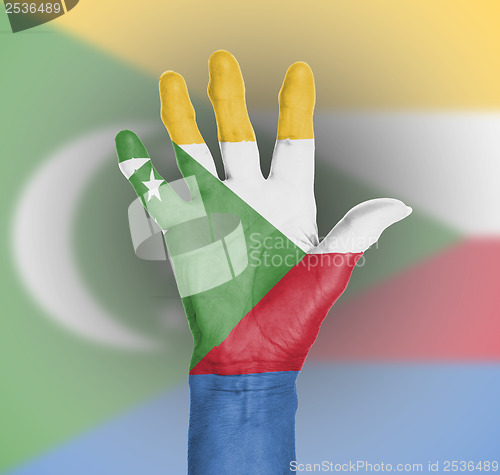 Image of Palm of a woman hand, painted with flag