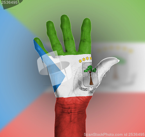 Image of Palm of a woman hand, painted with flag