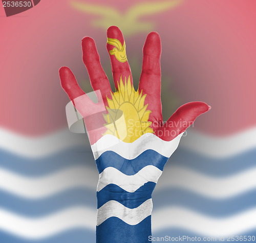 Image of Palm of a woman hand, painted with flag