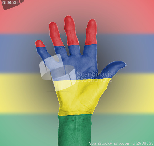 Image of Palm of a woman hand, painted with flag