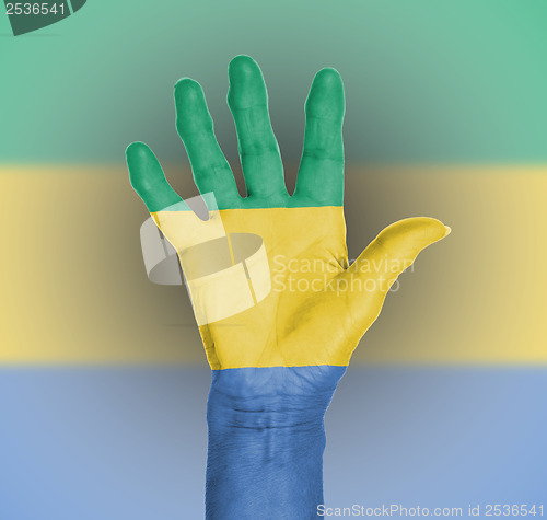 Image of Palm of a woman hand, painted with flag