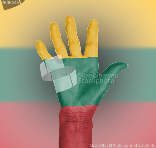 Image of Palm of a woman hand, painted with flag