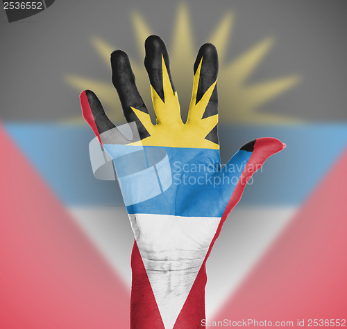 Image of Palm of a woman hand, painted with flag