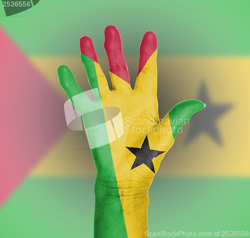 Image of Palm of a woman hand, painted with flag