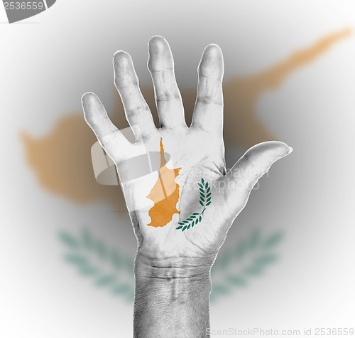 Image of Palm of a woman hand, painted with flag