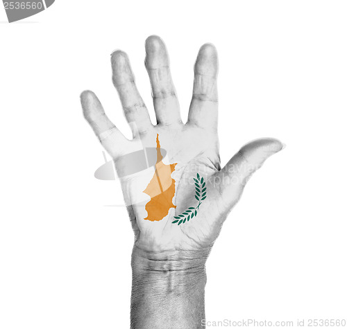 Image of Palm of a woman hand, painted with flag