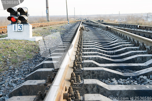 Image of railway with stop signal lamp