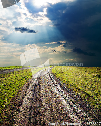 Image of dirty road under dramatic sky